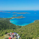 Aerial view of St John Virgin Islands with green hills and turquoise bays above Cruz Bay