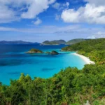 Trunk Bay St John beach and Trunk Cay from the overlook, turquoise water and green hills
