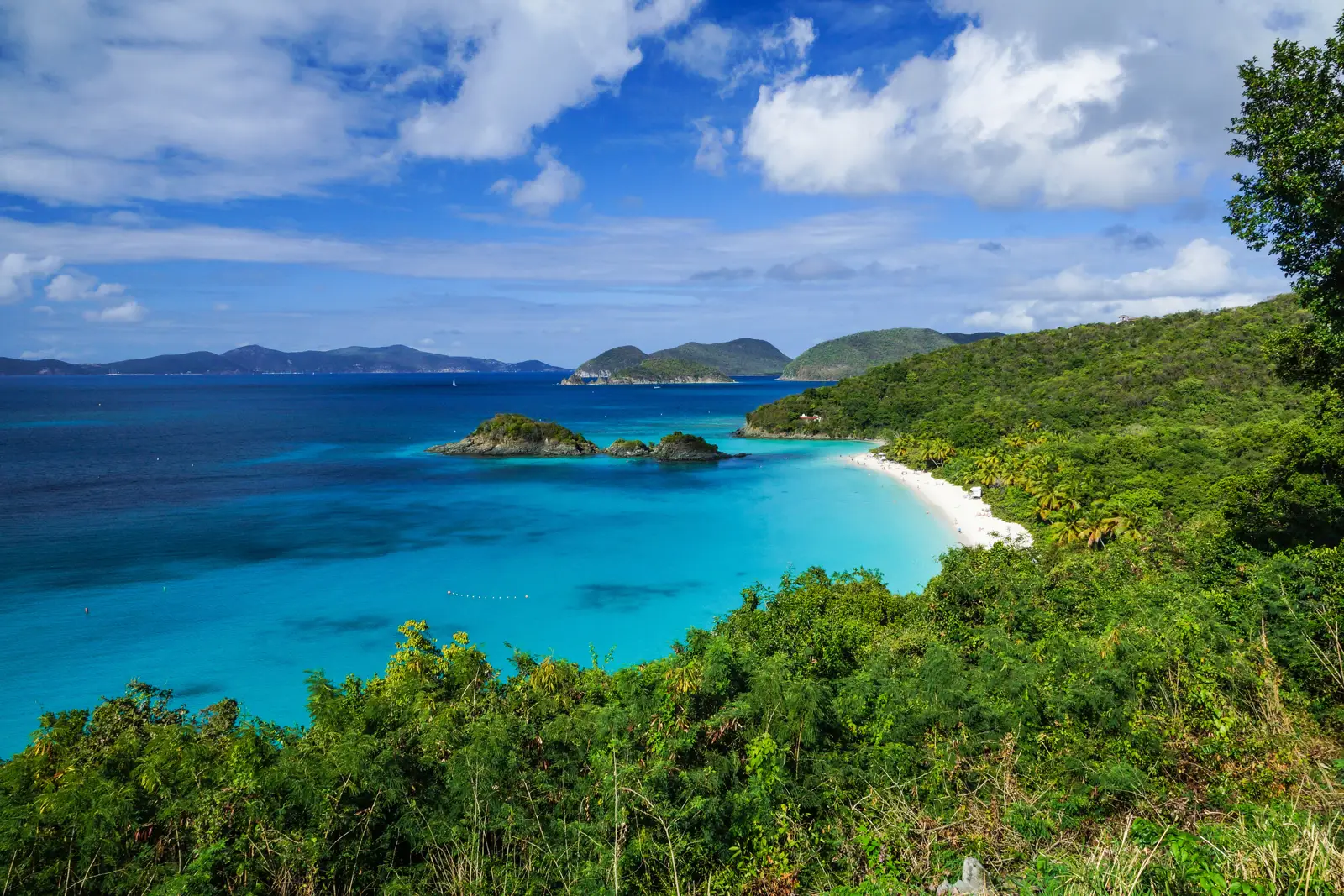 Trunk Bay St John beach and Trunk Cay from the overlook, turquoise water and green hills